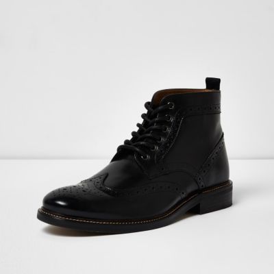 Black leather brogue boots